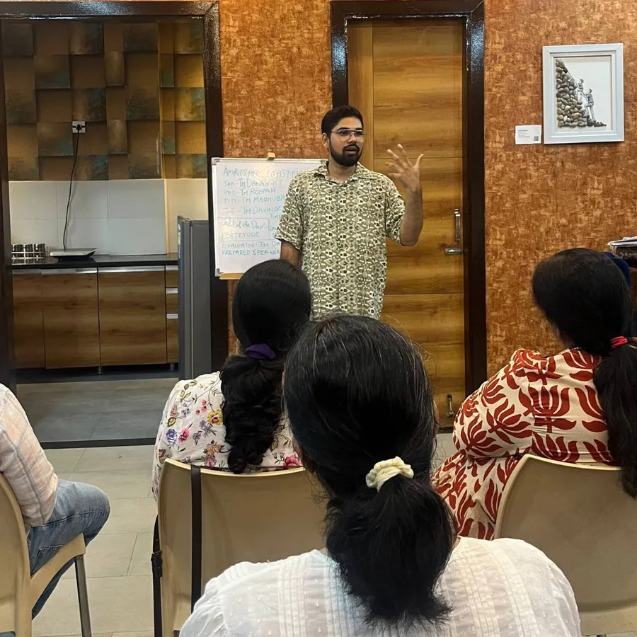 A member speaking to a seated audience